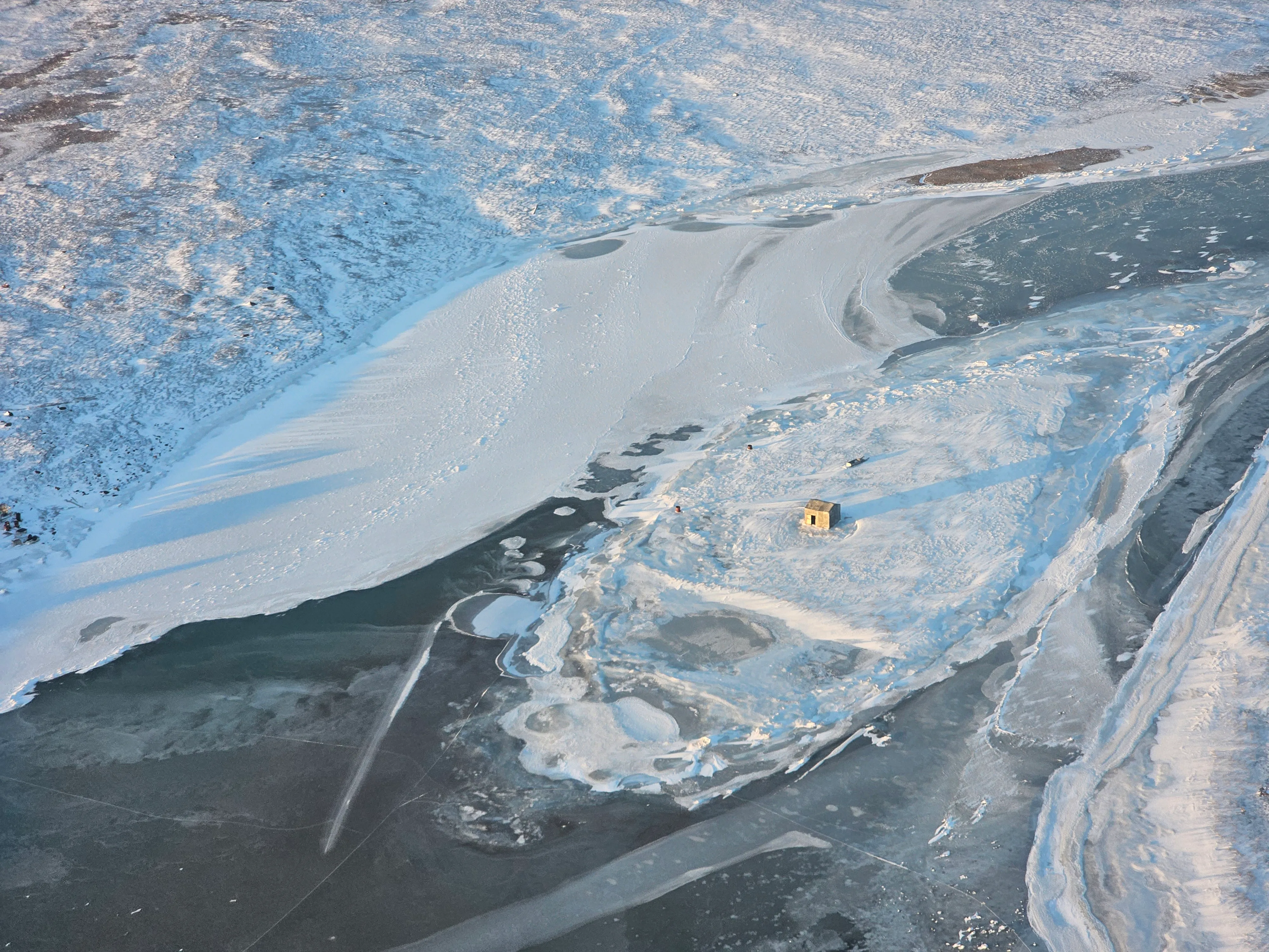 A small cabin on a frozen lake on the south coast of the Victoria Islands (Credit Terry Milton + Government of Nunavut)